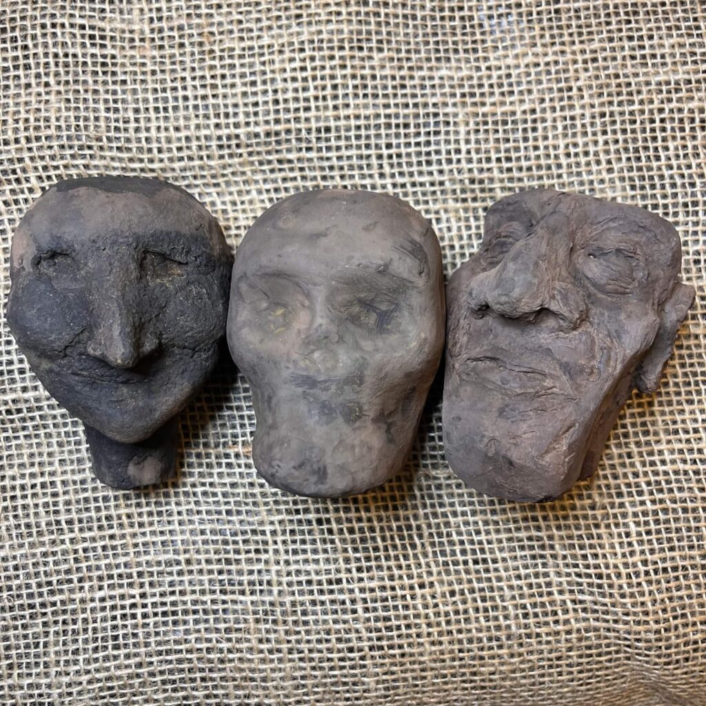 3 puppet heads, stained but unadorned